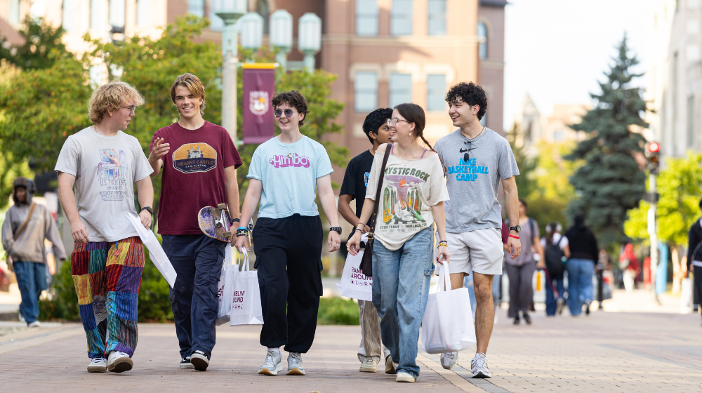 A group of students walking around campus.